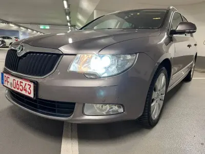 Używany Skoda Superb Elegance 140 KM (102 kW) 2012 Purpurowy Kombi