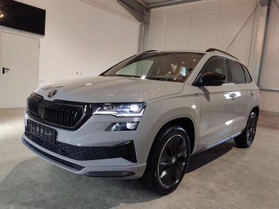 gebraucht Skoda Karoq Sportline Plus Edition 1.5 TSI 150 PS DSG-Navi-ACC-SHZ-RFK-18"-Sofort