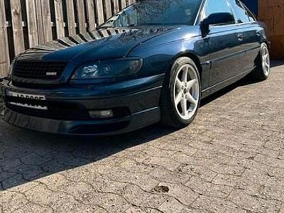Second-hand Opel Omega 144 CP (105 kW) 1999 Albastru Berlinǎ