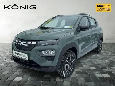 Gebraucht Dacia Spring Comfort 47 kW (65 PS) 2023 Olivgrün Kleinwagen