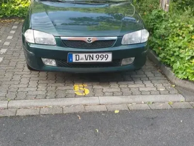 Gebraucht Mazda 323 74 PS (54 kW) 1999 Grün Limousine