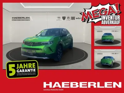 Gebraucht Opel Mokka Elegance 101 PS (74 kW) 2023 Matcha green/ikone gruen (metallic) SUV