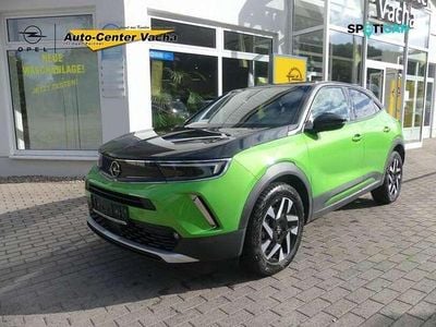Gebraucht Opel Mokka-e Elegance 100 kW (136 PS) 2021 Matcha green/ikone gruen (metallic) SUV