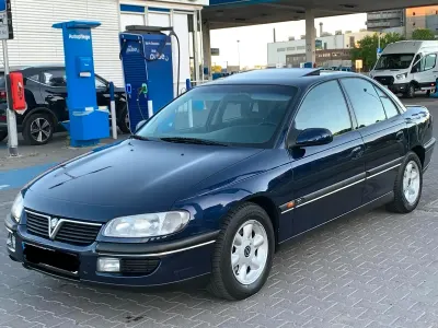 Second-hand Opel Omega 170 CP (125 kW) 1996 Albastru Berlinǎ