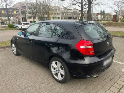 Second-hand BMW 116 122 CP (89 kW) 2007 Negru Hatchback