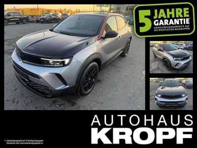 Gebraucht Opel Mokka-e GS Line 100 kW (136 PS) 2023 Kontrast grau/quarz silber SUV