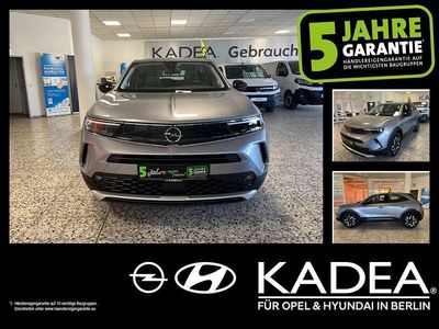 Gebraucht Opel Mokka Elegance 131 PS (96 kW) 2022 Kontrast grau/quarz silber (metallic) SUV