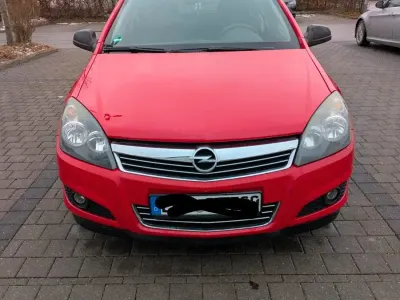 Używany Opel Astra 115 KM (84 kW) 2009 Czerwony Sedan/Limuzyna