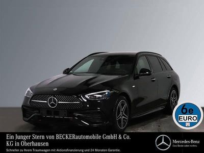 Obsidianschwarz Gebraucht 2024 Mercedes C300e AMG Kombi | 48.575 € (Teuer)