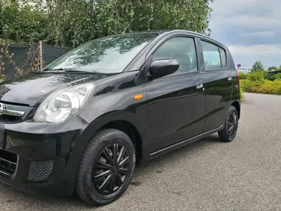 Gebraucht Daihatsu Cuore 69 PS (50 kW) 2011 Schwarz Kleinwagen
