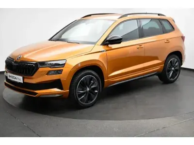 Gebraucht Skoda Karoq SportLine 190 PS (139 kW) 2023 Phoenixorange metallic SUV