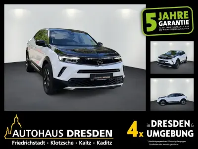 Gebraucht Opel Mokka-e Elegance 100 kW (136 PS) 2022 Jade weiss (metallic) SUV