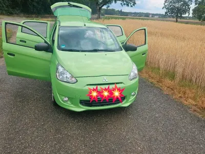 Gebraucht Mitsubishi Space Star 70 PS (51 kW) 2013 Grün Van / Kleinbus