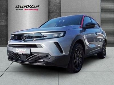 Gebraucht Opel Mokka-e GS Line 100 kW (136 PS) 2024 Kontrast grau/quarz silber SUV
