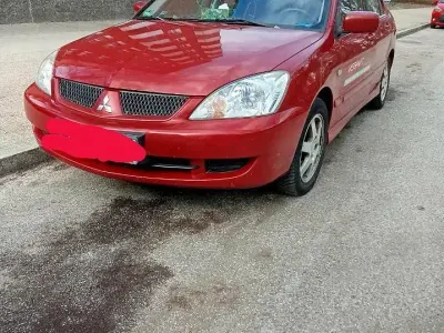 Usata Mitsubishi Lancer Top 98 CV (72 kW) 2006 Rosso Station wagon