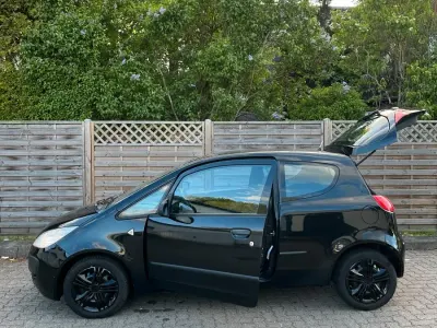 Gebraucht Mitsubishi Colt Top 95 PS (69 kW) 2006 Schwarz Kleinwagen