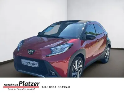 Gebraucht Toyota Aygo X X-plore 72 PS (52 kW) 2024 3u4)/ black mica (209) (rot SUV