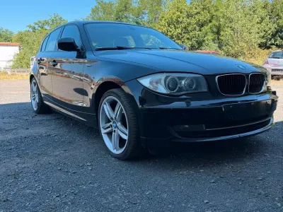 Gebraucht BMW 116 122 PS (89 kW) 2010 Schwarz Kleinwagen