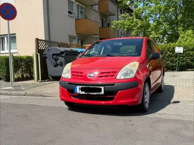 Gebraucht Nissan Pixo Acenta 68 PS (50 kW) 2010 Rot Kleinwagen