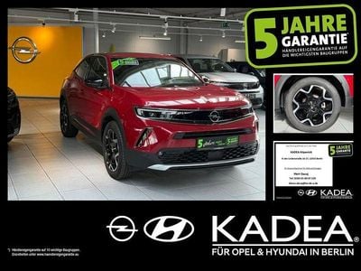 Gebraucht Opel Mokka-e Ultimate 100 kW (136 PS) 2023 Lackierung rot rubi/typ aussenverkleidun (metallic) SUV