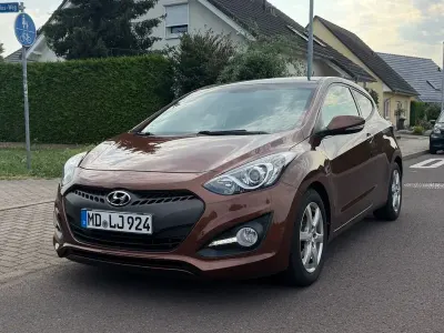 Gebraucht Hyundai i30 128 PS (94 kW) 2013 Orange Coupé