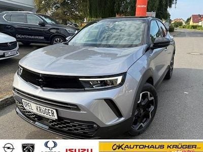 Gebraucht Opel Mokka Ultimate 131 PS (96 kW) 2023 Kontrast grau/quarz silber (metallic) SUV