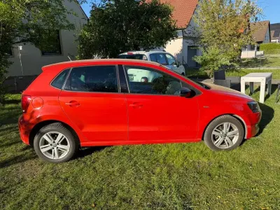 Gebraucht VW Polo Match 69 PS (50 kW) 2012 Hot orange Kleinwagen