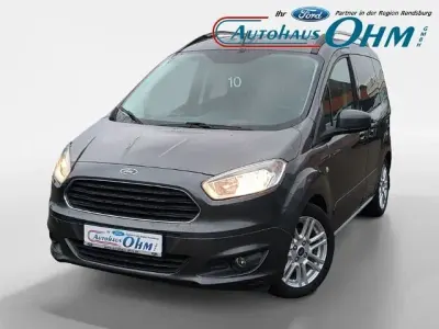 Gebraucht Ford Tourneo Courier Titanium 101 PS (74 kW) 2016 Magneticgrau (metallic) Van / Kleinbus