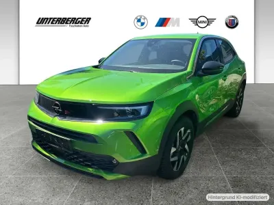 Gebraucht Opel Mokka-e Elegance 100 kW (136 PS) 2023 Lackierung matcha green/typ au SUV