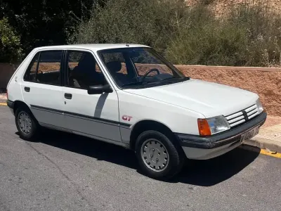 Gebraucht Peugeot 205 GTi 83 PS (61 kW) 1987 Weiß Limousine