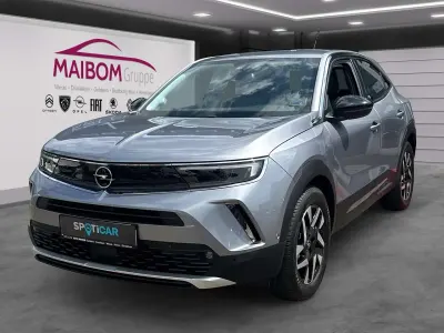 Gebraucht Opel Mokka-e Elegance 100 kW (136 PS) 2021 Kontrast grau/quarz silber SUV