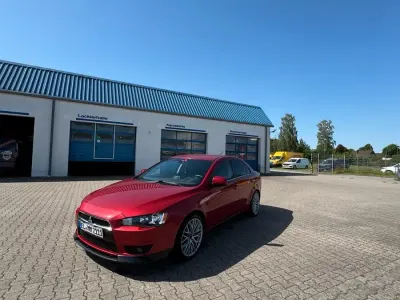 Gebraucht Mitsubishi Lancer 117 PS (86 kW) 2012 Rot Limousine