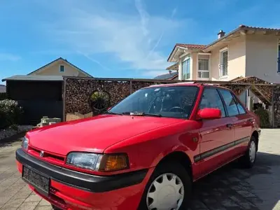 Używany Mazda 323 88 KM (64 kW) 1992 Czerwony Sedan/Limuzyna