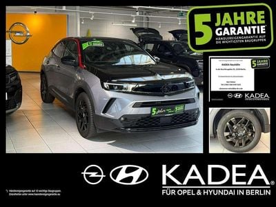 Gebraucht Opel Mokka-e 100 kW (136 PS) 2023 Kontrast grau/quarz silber SUV