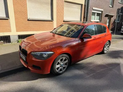 Używany BMW 120 Sport Line 184 KM (135 kW) 2012 Pomarańczowy Hatchback