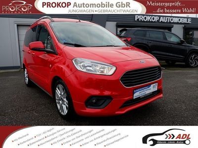 gebraucht Ford Tourneo Courier Titanium AAC GRA 2xPDC Winter-Paket Navi DAB