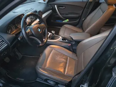 Gebraucht BMW 116 122 PS (89 kW) 2009 Schwarz Kleinwagen