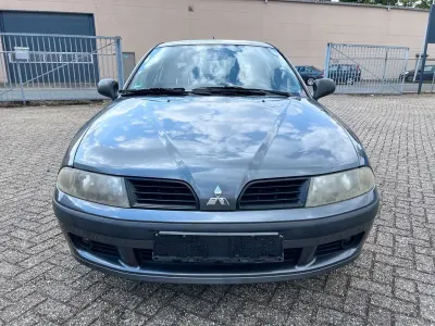 Begagnad Mitsubishi Carisma Comfort Edition 103 HK (75 kW) 2004 Grå Sedan