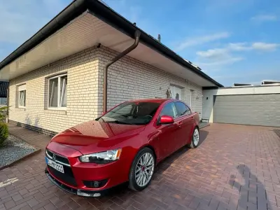 Gebraucht Mitsubishi Lancer 117 PS (86 kW) 2012 Rot Limousine