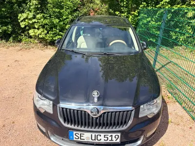 Używany Skoda Superb 163 KM (119 kW) 2011 Czarny Kombi