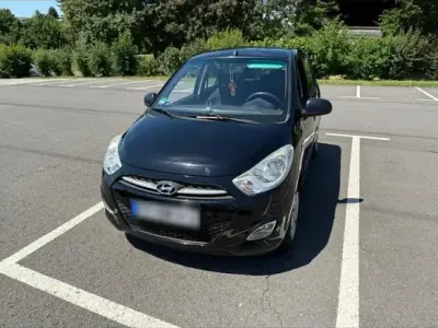 Gebraucht Hyundai i10 69 PS (50 kW) 2011 Schwarz Kleinwagen