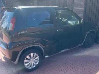 Gebraucht Suzuki Ignis 83 PS (61 kW) 2001 Schwarz Kleinwagen
