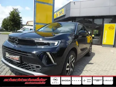 Gebraucht Opel Mokka-e Elegance 100 kW (136 PS) 2023 Karbon schwarz metallic SUV