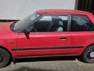 Gebraucht Mazda 323 73 PS (53 kW) 1992 Rot Kleinwagen