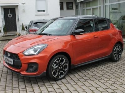 Gebraucht Suzuki Swift Sport 129 PS (94 kW) 2023 Flame orange / super black pearl metalli (metallic) Kleinwagen