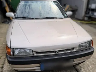 Gebraucht Mazda 323 88 PS (64 kW) 1991 Braun Kleinwagen