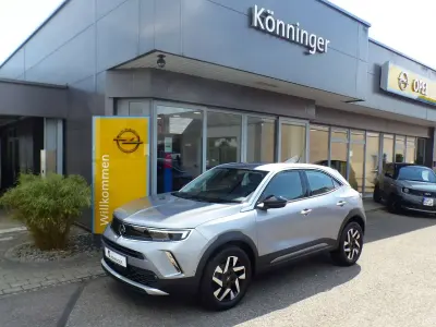 Gebraucht Opel Mokka Elegance 131 PS (96 kW) 2021 Kontrast grau/quarz silber SUV