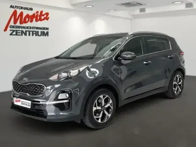 Gebraucht Kia Sportage Vision 177 PS (130 kW) 2020 H8g) pentametal met. (grau SUV