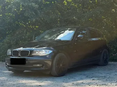 Gebraucht BMW 116 122 PS (89 kW) 2010 Schwarz Kleinwagen