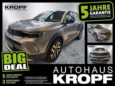 Gebraucht Opel Mokka-e Elegance 100 kW (136 PS) 2022 Kontrast grau/quarz silber SUV